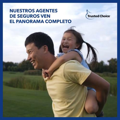 Dad carrying his daughter by piggy back - left text